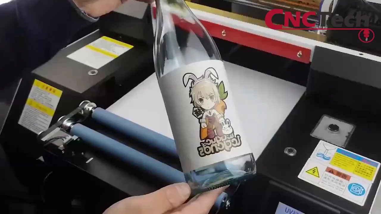 UV direct : bouteille sur un support rotatif